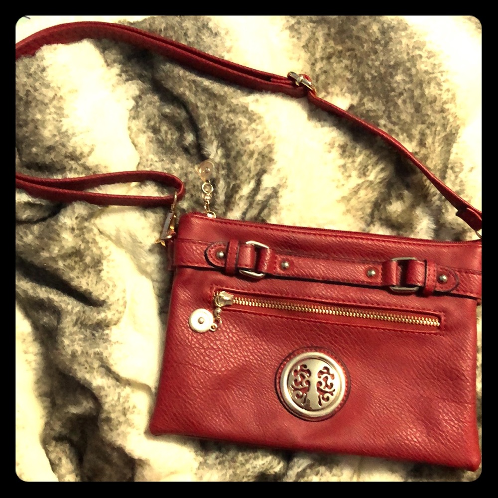 Red shoulder bag with tree logo.